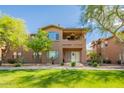 Beautiful two-story condo with well-manicured lawn, mature trees, and inviting covered balcony at 11500 E Cochise Dr # 2088, Scottsdale, AZ 85259