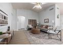 Bright living room with vaulted ceilings, modern furnishings, and lots of natural light at 11520 W Lizard Ct, Surprise, AZ 85378