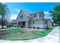Two-story home with well-maintained front yard, covered porch, and neutral color scheme at 12161 W Flanagan St, Avondale, AZ 85323