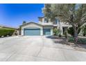 Inviting home with a three-car garage and drought-resistant desert landscaping at 14430 W Windsor Ave, Goodyear, AZ 85395