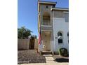 Exterior shot showcasing a two-story home with a small front balcony, accented by an American flag at 1448 E Mobile Ln, Phoenix, AZ 85040