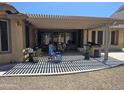 Covered patio with outdoor seating and built in grill at 15352 W Ventura St, Surprise, AZ 85379