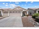Charming home featuring neutral stucco, a three-car garage, and well-maintained landscaping at 16636 S 22Nd St, Phoenix, AZ 85048