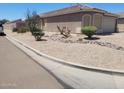 Inviting single-story home with low-maintenance desert landscaping for easy care at 1769 E Jacob St, San Tan Valley, AZ 85140