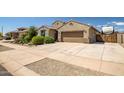 Charming single-Gathering home with a well-manicured lawn and an attached two-car garage at 18662 W Foothill Dr, Surprise, AZ 85387