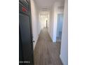 Inviting hallway features sleek wood-look tile flooring and leads to the home's open living spaces at 18795 E Bruno Dr, Gold Canyon, AZ 85118