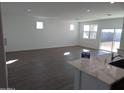 Bright living room with tile floors, recessed lights, and a sliding glass door to the backyard at 18795 E Bruno Dr, Gold Canyon, AZ 85118