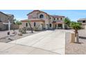 Charming two-story home with a spacious driveway and desert landscaping, perfect for curb appeal at 2726 S 160Th Ave, Goodyear, AZ 85338