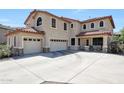 Inviting two-story home boasting a three-car garage and covered porch, set in a friendly neighborhood at 2726 S 160Th Ave, Goodyear, AZ 85338