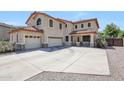 Beautiful two-story home featuring a three-car garage and a meticulously kept front yard at 2726 S 160Th Ave, Goodyear, AZ 85338