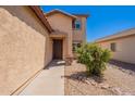 Inviting front entrance with a covered porch and landscaped yard at 5305 E Silverbell Rd, San Tan Valley, AZ 85143