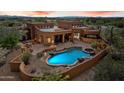 Inviting backyard pool and patio area offering a tranquil outdoor living space at 7728 E Mary Sharon Dr, Scottsdale, AZ 85266