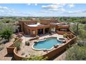 Beautiful desert home featuring a private pool and spa, perfect for relaxation at 7728 E Mary Sharon Dr, Scottsdale, AZ 85266