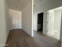 Welcoming foyer with wood-look tile flooring that flows into the home's entryway at 9532 W Parkway Dr, Tolleson, AZ 85353
