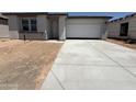 Charming single-story home with a two-car garage and a well-maintained driveway at 9532 W Parkway Dr, Tolleson, AZ 85353