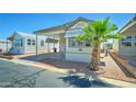 Well-maintained manufactured home with carport, desert landscaping, and lovely curb appeal at 111 S Greenfield Rd # 244, Mesa, AZ 85206
