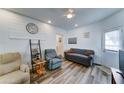 Inviting living room with vinyl flooring, ample seating, and plenty of natural light at 111 S Greenfield Rd # 244, Mesa, AZ 85206