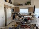 Functional kitchen with ample cabinet space and a window overlooking the backyard at 12955 E Sahuaro Dr, Scottsdale, AZ 85259