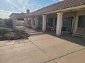 A spacious outdoor patio with seating, perfect for entertaining guests and enjoying outdoor living at 12955 E Sahuaro Dr, Scottsdale, AZ 85259