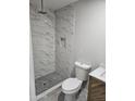 Newly renovated bathroom with marble tile shower and modern fixtures at 15445 N Verde St, Surprise, AZ 85378