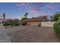 Charming single-story home with desert landscaping, spacious driveway and white gate at 15849 N 46Th Pl, Phoenix, AZ 85032