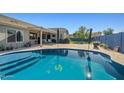 Sparkling pool with turtle mosaic and spacious patio area perfect for outdoor entertaining at 16396 W Fillmore St, Goodyear, AZ 85338