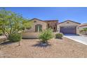 Single-story home with desert landscaping, offering low maintenance and attractive curb appeal at 189 N Rainbow Way, Casa Grande, AZ 85194
