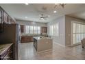 Spacious kitchen boasts a center island, stainless steel appliances, and sleek countertops at 189 N Rainbow Way, Casa Grande, AZ 85194