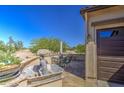 Outdoor patio with desert views, features a decorative fountain and comfortable seating area at 189 N Rainbow Way, Casa Grande, AZ 85194
