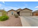 Beautiful home with a two-car garage, desert landscaping, and modern design elements at 2148 W Angelo Way, San Tan Valley, AZ 85144