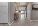 Elegant foyer leading into an open living space with tile flooring and neutral decor at 2148 W Angelo Way, San Tan Valley, AZ 85144
