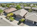 Charming single-Gathering home features well-manicured landscaping, inviting curb appeal, and a two-car garage at 21539 N 72Nd Pl, Scottsdale, AZ 85255