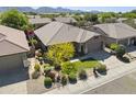Aerial view showcases this charming property with green lawn and landscaping, set in a peaceful neighborhood at 21539 N 72Nd Pl, Scottsdale, AZ 85255