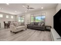 Inviting living room featuring abundant natural light and views of the outdoor landscape at 27418 W Mohawk Ln, Buckeye, AZ 85396