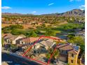 Aerial view of the property highlights its location in a golf course community with mountain views at 3277 E Meadowview Dr, Gilbert, AZ 85298