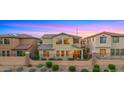 Back of home features multi-story living with view fence and lush landscaping in a well-kept yard at 3277 E Meadowview Dr, Gilbert, AZ 85298