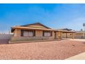 Charming single-story brick home featuring a carport and low-maintenance desert landscaping at 3901 W Augusta Ave, Phoenix, AZ 85051