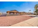 Charming single-story brick home featuring a carport and low-maintenance desert landscaping at 3901 W Augusta Ave, Phoenix, AZ 85051