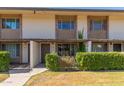 Inviting townhome exterior featuring private entrances, lush landscaping and a well-maintained lawn at 4701 N 68Th St # 214, Scottsdale, AZ 85251