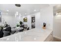 Bright living room featuring wood flooring, a dining area, and an open floor plan at 4800 N 68Th St # 207, Scottsdale, AZ 85251