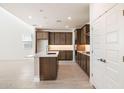 Modern kitchen with stainless steel appliances, a center island, and plenty of countertop space at 7385 W Buckhorn Trl, Peoria, AZ 85383