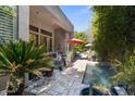 Beautiful backyard pool area with a covered patio, lush greenery, and an inviting swimming pool at 742 W Puget Ave, Phoenix, AZ 85021