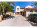 Stunning home with a spacious driveway, two-car garage, and meticulous landscaping, highlighting the property's charm and appeal at 7925 S 52Nd Dr, Laveen, AZ 85339