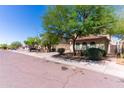 Beautiful single-Gathering home featuring a tile roof and charming front yard landscaping, perfect for serene suburban living at 7925 S 52Nd Dr, Laveen, AZ 85339