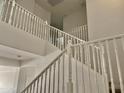 Bright, carpeted staircase with white railings at 7925 S 52Nd Dr, Laveen, AZ 85339