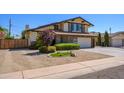 Charming two-story home with well-maintained landscaping and a spacious driveway at 8419 E Stella Ln, Scottsdale, AZ 85250