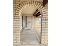 Charming entrance featuring an arched doorway and inviting welcome mat at 9601 N 35Th Dr, Phoenix, AZ 85051