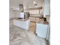 Bright kitchen featuring granite countertops, new appliances, and tile flooring at 9601 N 35Th Dr, Phoenix, AZ 85051