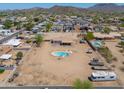 Aerial view of desert property highlighting the spacious lot, home, pool, and neighborhood at 9713 E El Paso St, Mesa, AZ 85207