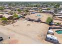 Expansive desert lot with a well-maintained home, pool, and plenty of space for recreation and RV parking at 9713 E El Paso St, Mesa, AZ 85207